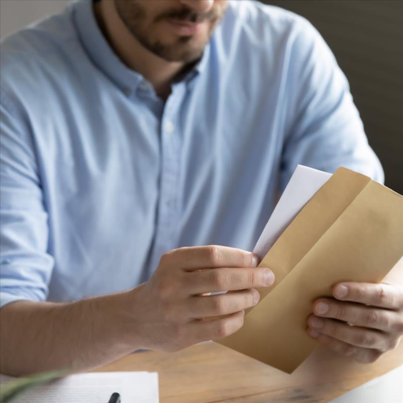 Man Holding an Envelope