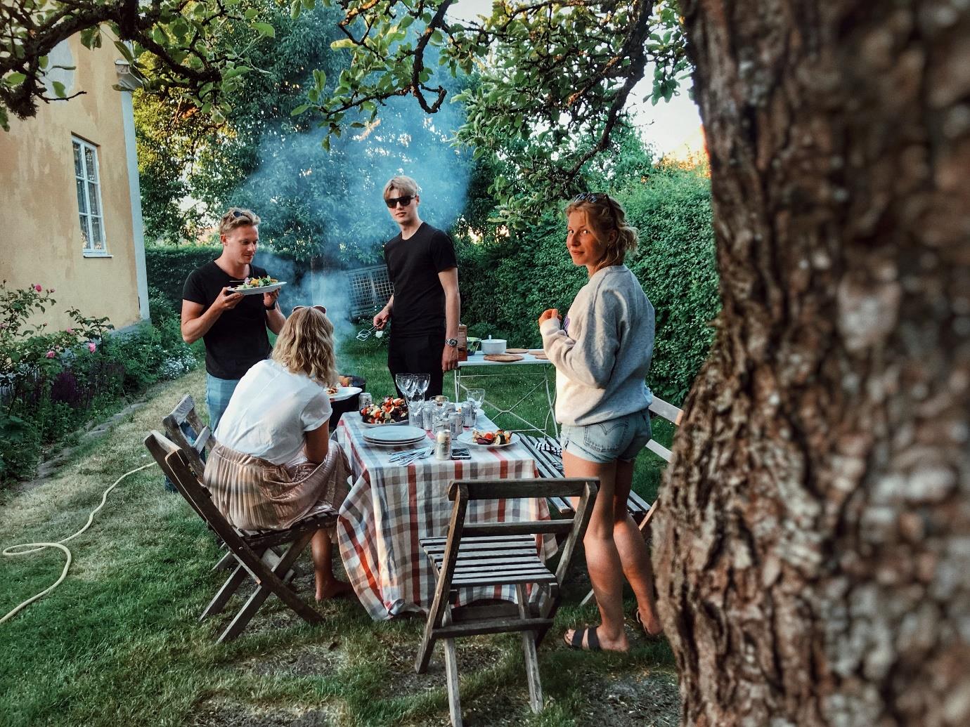 A group of people sitting in a tree
Description automatically generated