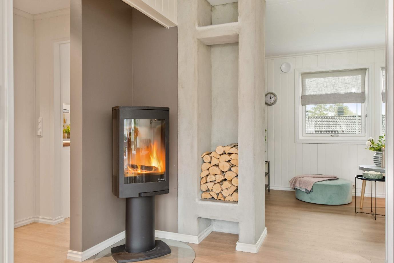 A fire place sitting in a room

Description automatically generated